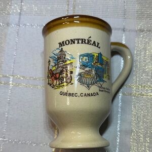 Vintage ceramic souvenir coffee mug with illustration of Montreal Quebec OS